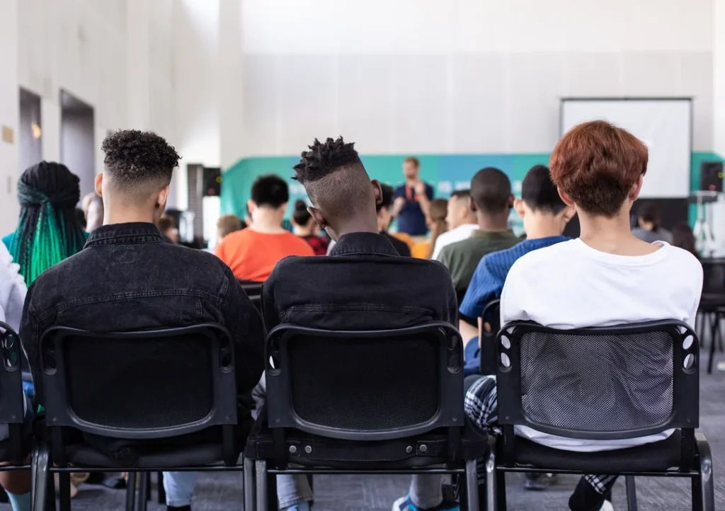 group of students in small high school classroom