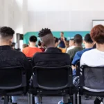 group of students in small high school classroom